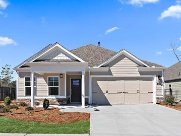 Charming single-story home with a manicured front yard and a two-car garage at 1209 Cedarcrest Blvd, Acworth, GA 30101