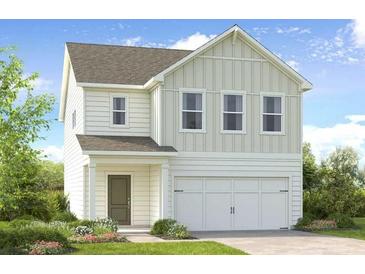 Charming two-story home featuring a two-car garage, complemented by a well-manicured lawn and inviting curb appeal at 207 Groveton Ct, Euharlee, GA 30145