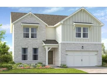 Charming two-story home with white brick and board and batten, complemented by a manicured lawn at 209 Groveton Ct, Euharlee, GA 30145