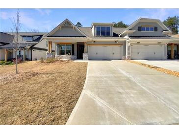 Charming home featuring a two-car garage and a manicured front lawn at 272 Laurel Canyon Pkwy, Canton, GA 30114