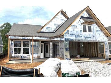 New construction home showing the exterior with windows, door and siding materials ready to be installed at 138 Laurel Farms Ln, Dallas, GA 30157