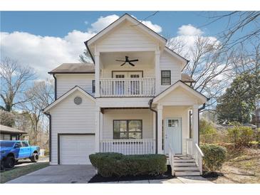 Charming two-story home featuring a double porch and light blue front door at 260 Westview Sw Pl, Atlanta, GA 30314