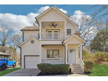 Charming two-story home with a covered porch, balcony, garage and well-maintained lawn at 260 Westview Sw Pl, Atlanta, GA 30314