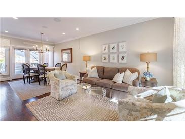 Bright living room featuring hardwood floors, elegant decor, and comfortable seating at 78 Paces West Nw Cir, Atlanta, GA 30327