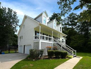 Charming two-story home with a welcoming front porch and attached two-car garage at 53 Carrington Lndg, Douglasville, GA 30134