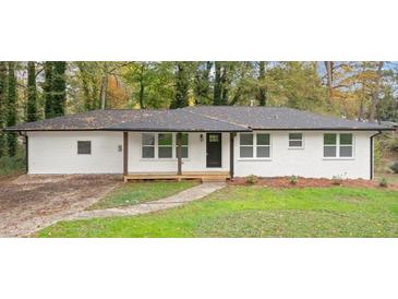 Charming single-story home featuring a modern exterior and well-maintained front yard at 5539 Andrew Sw Dr, Mableton, GA 30126
