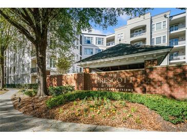 The Prescott at Park Place features luxury condominiums with mature landscaping and brick accents near a sidewalk at 11 Perimeter E Ctr # 1115, Atlanta, GA 30346