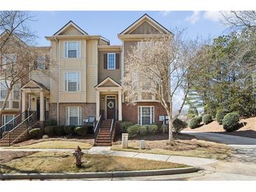 Charming townhome featuring a combination of brick and siding with a welcoming front entrance at 3930 Covey Flush Sw Ct # 21, Smyrna, GA 30082