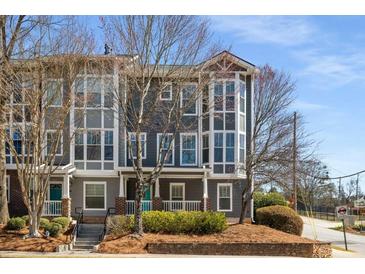 Charming townhome with gray siding, multi-pane windows, and inviting curb appeal at 1126 Park Row South Se, Atlanta, GA 30312