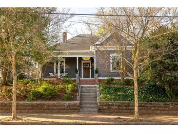 Charming home with a welcoming front porch and lush landscaping at 629 Hansell Se St, Atlanta, GA 30312