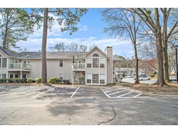 Charming condo with large windows and balcony, located in a tranquil neighborhood with ample parking at 1510 Gettysburg Pl, Atlanta, GA 30350