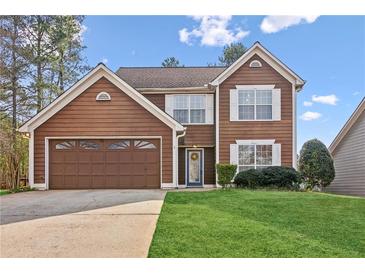 Charming two-story home with brown siding, white trim, and a well-manicured lawn at 848 Gateshead Ct, Lawrenceville, GA 30043