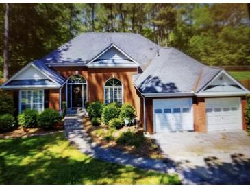 Charming brick home with an attached garage and mature landscaping at 97 Old Burnt Hickory Rd, Acworth, GA 30101