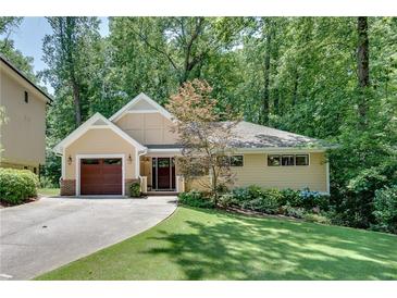 Charming single-Gathering home with a manicured lawn and a private driveway at 1233 Poplar Grove Ne Dr, Atlanta, GA 30306
