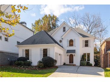 Charming two-story home with a gray roof, white exterior, and a well-manicured front yard at 3220 Silver Lake Ne Dr, Brookhaven, GA 30319