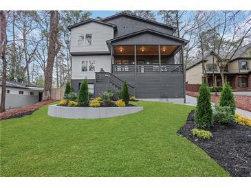 Beautiful two-story home with covered porch and well-manicured landscaping at 2497 Wawona Ne Dr, Brookhaven, GA 30319