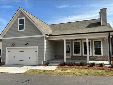 Charming single-Gathering home with a two-car garage, covered porch, and neutral gray siding and roof at 241 Saratoga Dr, Acworth, GA 30102