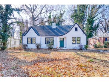 Charming brick home with a lush front yard and a neatly manicured lawn at 1027 Mount Airy Sw Dr, Atlanta, GA 30311