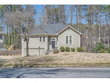 Charming home featuring a well-maintained front yard and inviting architecture at 1975 Hunt Crossing Ct, Lawrenceville, GA 30043