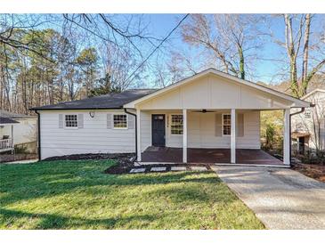 Charming single-story home with a covered front porch, manicured lawn, and a welcoming entrance at 2175 Venesa Cir, Austell, GA 30168