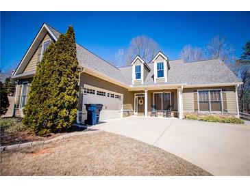 Charming one-story home featuring a well-manicured lawn and attached two-car garage at 95 Gorham Gates Dr, Hiram, GA 30141