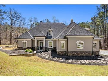 Stunning home featuring meticulous landscaping and charming architectural detail, perfect for elegant living at 3141 Buck Branch Sw Rd, Conyers, GA 30094