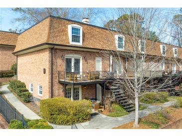 Brick townhouse with landscaped grounds, private balcony and cozy backyard spaces at 1261 Lavista Ne Rd # E9, Atlanta, GA 30324