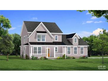 Charming two-story home with covered porch, landscaped yard, and craftsman-style details at 4045 Andover Cir, Mcdonough, GA 30252