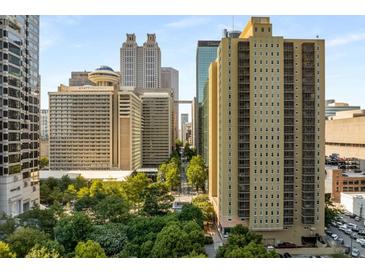 Stunning city view from this high-rise building, offering beautiful green spaces and vibrant downtown skyline at 300 Peachtree St # 23-A, Atlanta, GA 30308