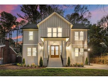 Beautiful two-story home with a well-manicured lawn, attractive curb appeal and a warm, inviting ambiance at 993 Northrope Ne Dr, Atlanta, GA 30324
