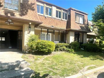 Charming multi-story townhouse with well-maintained landscaping and a inviting entrance at 3078 Parc Lorraine, Lithonia, GA 30038