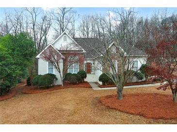 Charming single-Gathering home with a mix of brick and siding, complemented by lush landscaping at 9135 Woodhaven Way, Mcdonough, GA 30253