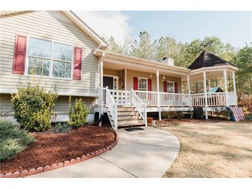 Inviting one-story home with a charming front porch and gazebo, perfect for relaxing and entertaining guests at 31 Wyngate Ct, Dallas, GA 30157