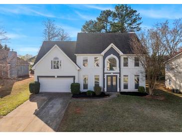 Beautiful two-story home with a manicured lawn, attached two-car garage, and striking curb appeal at 4275 Azalea Walk, Ellenwood, GA 30294