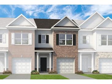 Charming brick front townhome with a well-manicured lawn and a one-car garage at 315 Skye Ln # 50, Cartersville, GA 30121