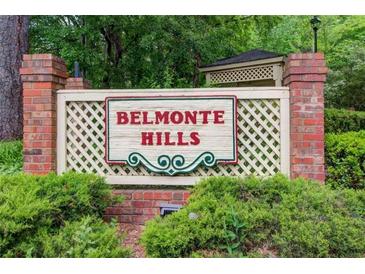 Belmonte Hills community sign with brick columns and a lattice backdrop, framed by lush green landscaping at 114 Belmonte Sw Dr, Atlanta, GA 30311