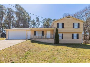 Charming two-story home featuring a spacious front yard and attached garage, perfect for Gathering living at 774 Marthas Dr, Lawrenceville, GA 30045