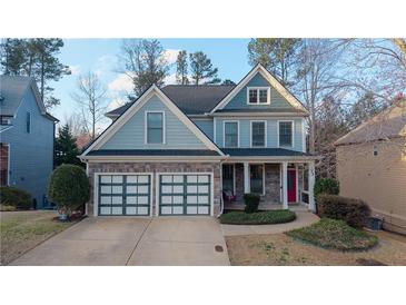 Charming two-story home featuring a two-car garage and a welcoming front porch at 93 Richmond Way, Villa Rica, GA 30180