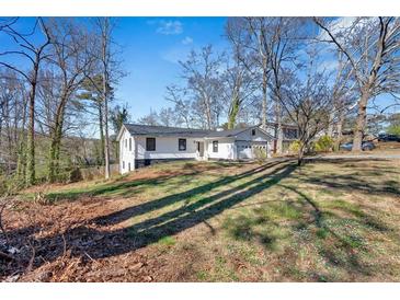 Charming renovated home with a new roof and inviting exterior, nestled on a spacious lawn at 383 Oakridge Se Dr, Cartersville, GA 30121