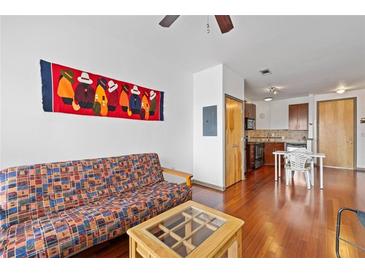 Bright living area with hardwood floors and an open floor plan to the kitchen space at 898 Oak Sw St # 3222, Atlanta, GA 30310