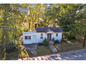 Charming home featuring a tidy front yard and a classic design that is awaiting your personal touch at 1653 Richmond Se Ave, Atlanta, GA 30315