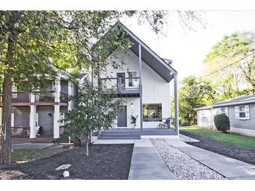 Modern two-story home with a grey trim, inviting front porch, and landscaped front yard at 179 South Se Ave, Atlanta, GA 30315