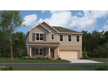 Charming two-story home featuring a brick and siding facade, a covered porch, and an attached two-car garage at 2493 Cotton Ln, Douglasville, GA 30135