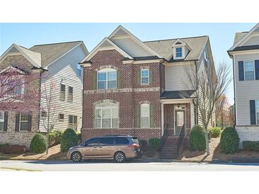 Charming brick two-story home with manicured front yard and inviting curb appeal at 3182 Hartford Mill Pl, Duluth, GA 30097