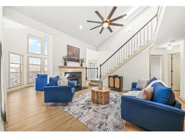 Bright living room with high ceilings, fireplace, and contemporary furnishings at 605 Mcgill Park Ne Ave, Atlanta, GA 30312