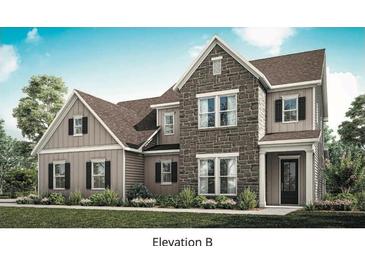 New construction home featuring stone and siding exterior with a well manicured lawn and a tasteful two-tone color palette at 128 Prescott Manor Dr, Canton, GA 30115