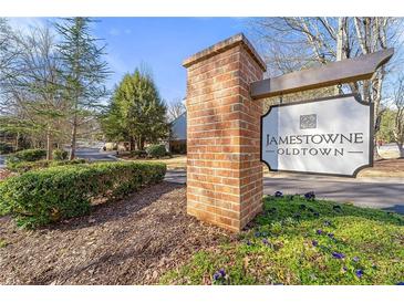 Welcoming Jamestown-Oldtown community sign with beautiful landscaping and mature trees, showcasing the neighborhood's charm at 2300 Newport Lndg, Alpharetta, GA 30009