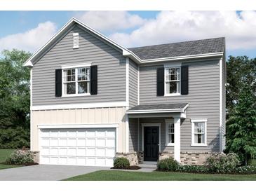 Charming two-story home with gray siding, black shutters, and a well-manicured lawn at 186 Sonoma Drive, Dallas, GA 30157