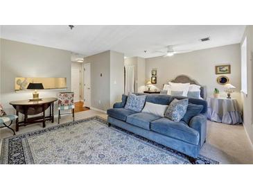 Bright, open floor plan with elegant decor and plush blue sofa adds charm at 300 Johnson Ferry Ne Rd # A313, Atlanta, GA 30328