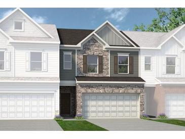 Charming townhome showcasing a stone facade and a two-car garage for added curb appeal at 206 Bastian Dr # 107, Villa Rica, GA 30180